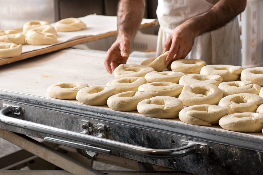 Close-up,Male,Baker,Hands,Making,Italian,Frisella,Bread,Donuts,,Placing